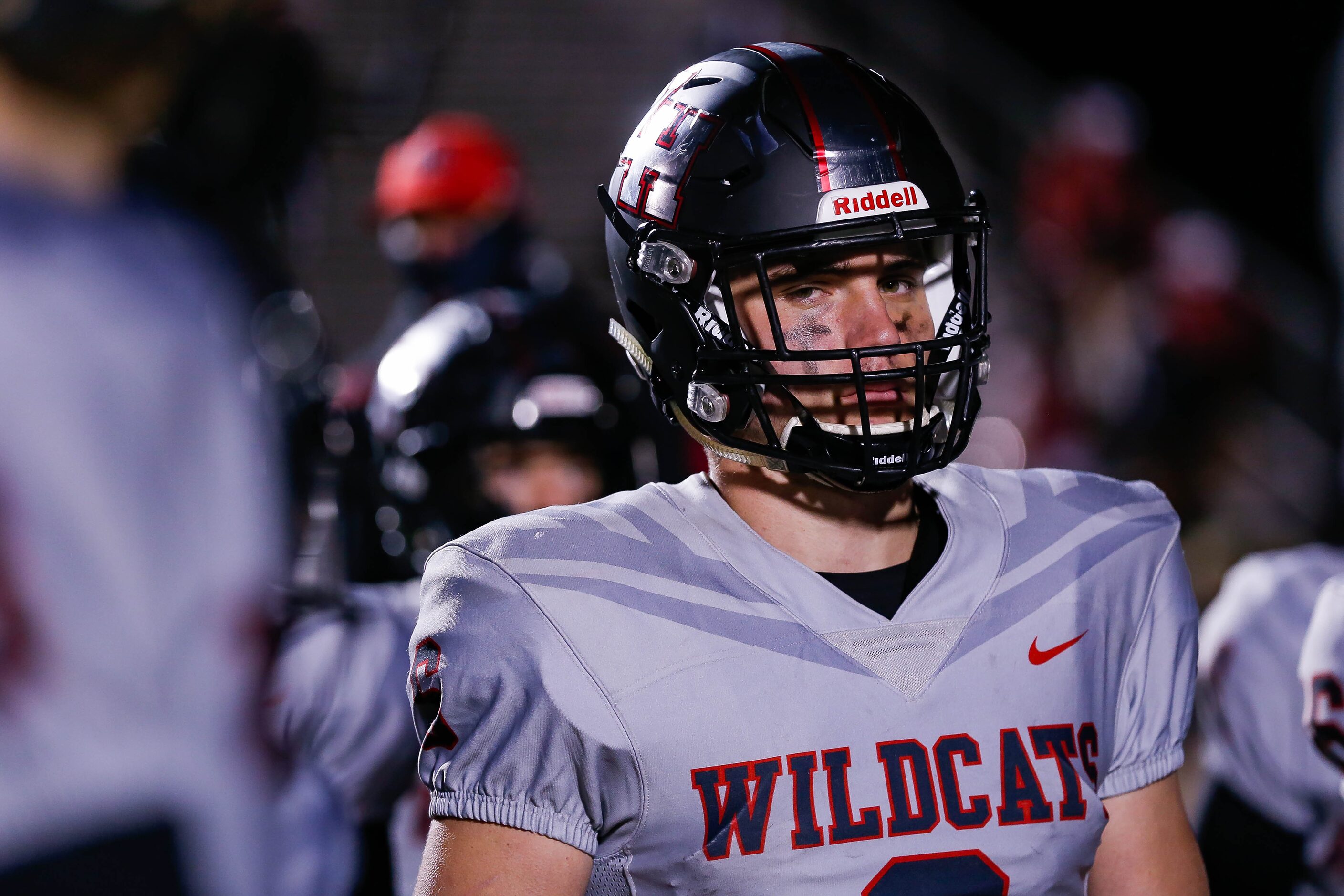 Lake Highlands' quarterback Mitch Coulson (6) listens to coach Lonnie Jordan speak to his...