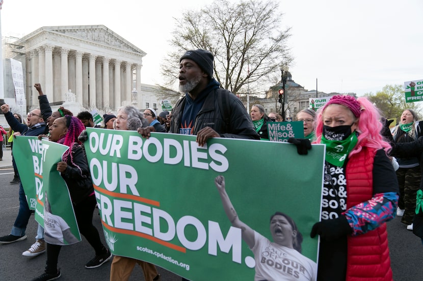 Abortion-rights activists rally outside of the Supreme Court, Tuesday, March 26, 2024, in...