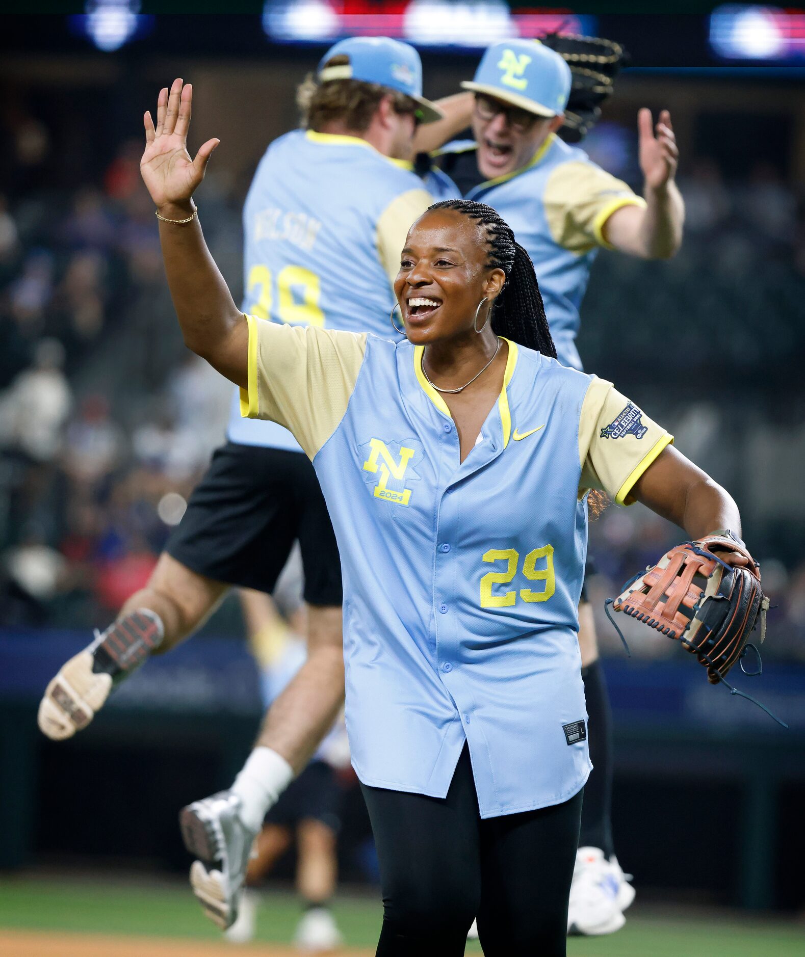 USA Softball Olympian Natasha Watley celebrates their teams pop-up out that was caught on a...