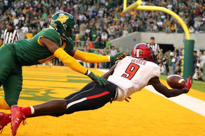 WACO, TEXAS - OCTOBER 12: T.J. Vasher #9 of the Texas Tech Red Raiders makes a touchdown...