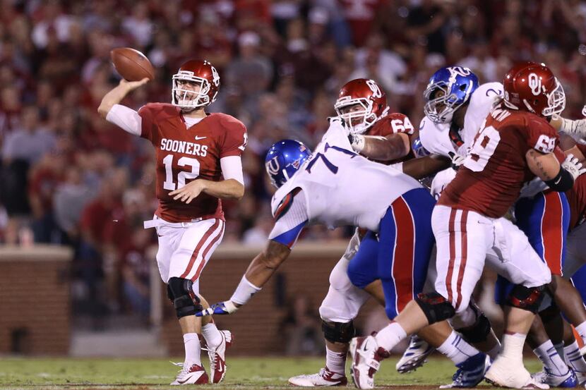 Oct 20, 2012; Norman, OK, USA; Oklahoma Sooner quarterback Landry Jones (12) throws in the...