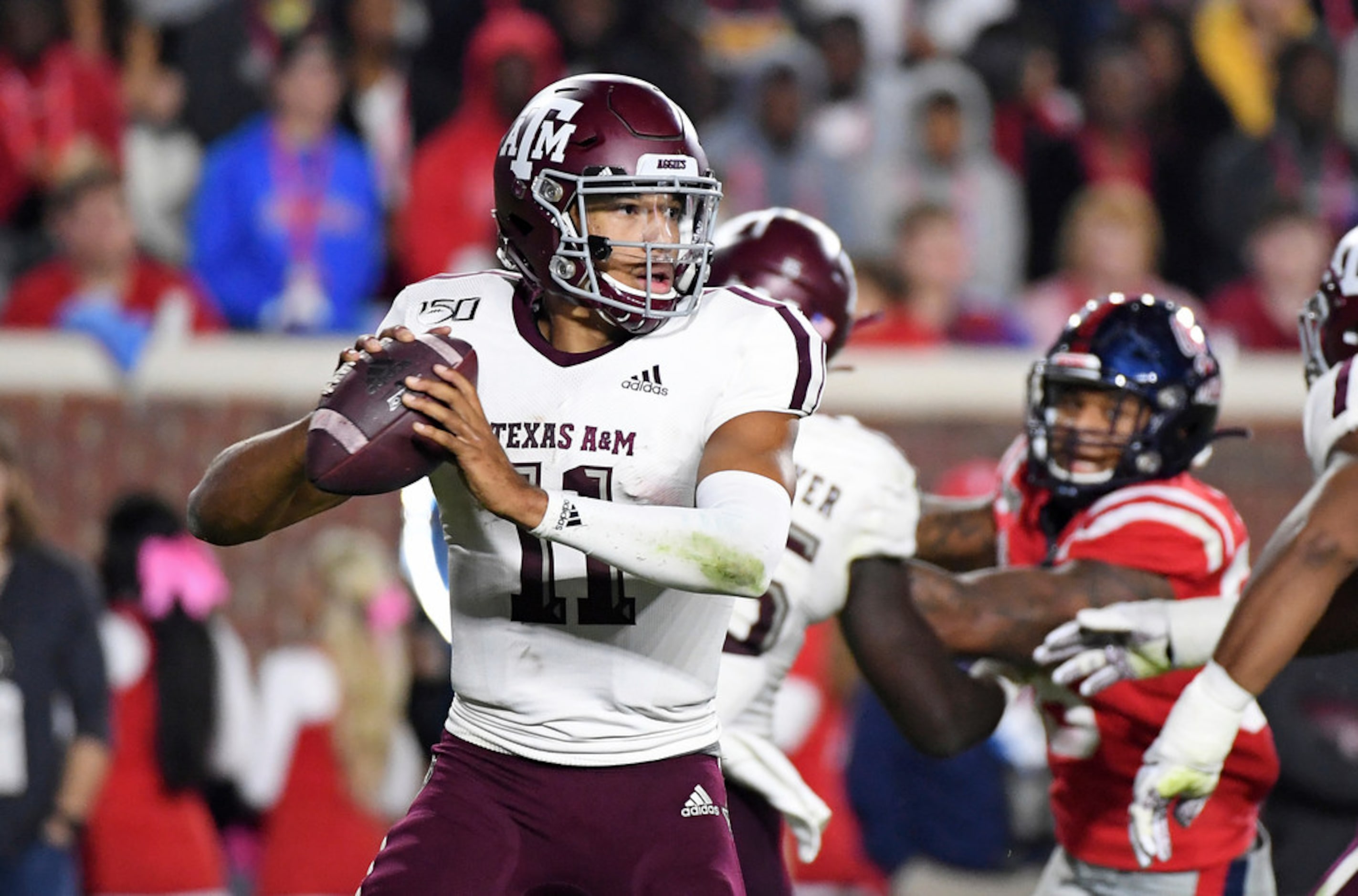 Texas A&M quarterback Kellen Mond (11) looks to pass during the first half of an NCAA...