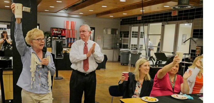 
Bishop Lynch Principal Evelyn Grubbs (left) gives Leyden a toast during a faculty breakfast...