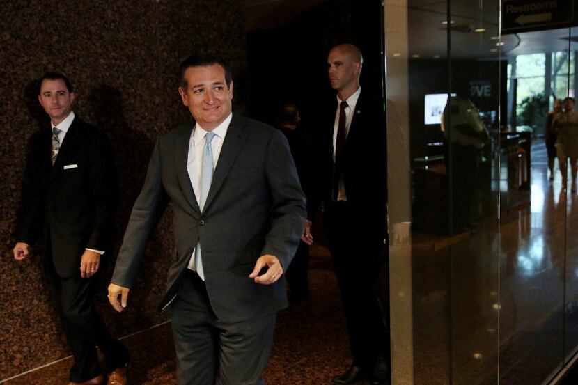 Texas senator Ted Cruz walks in to speak to reporters at the headquarters of Mark Kay in...