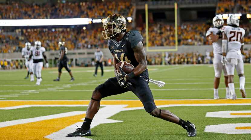 Baylor wide receiver Chris Platt (14) celebrates his 15-yard touchdown in the end zone...