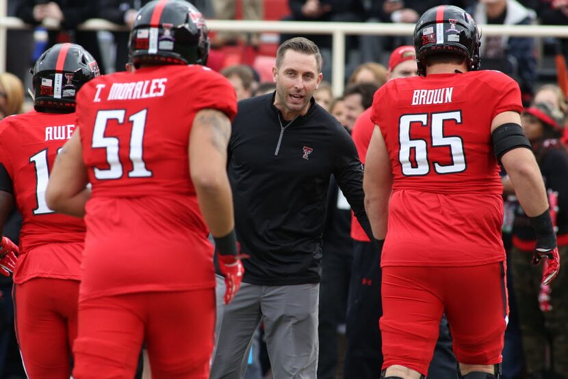 Nov 14, 2015; Lubbock, TX, USA; Texas Tech Red Raiders head coach Kliff Kingsbury greats the...