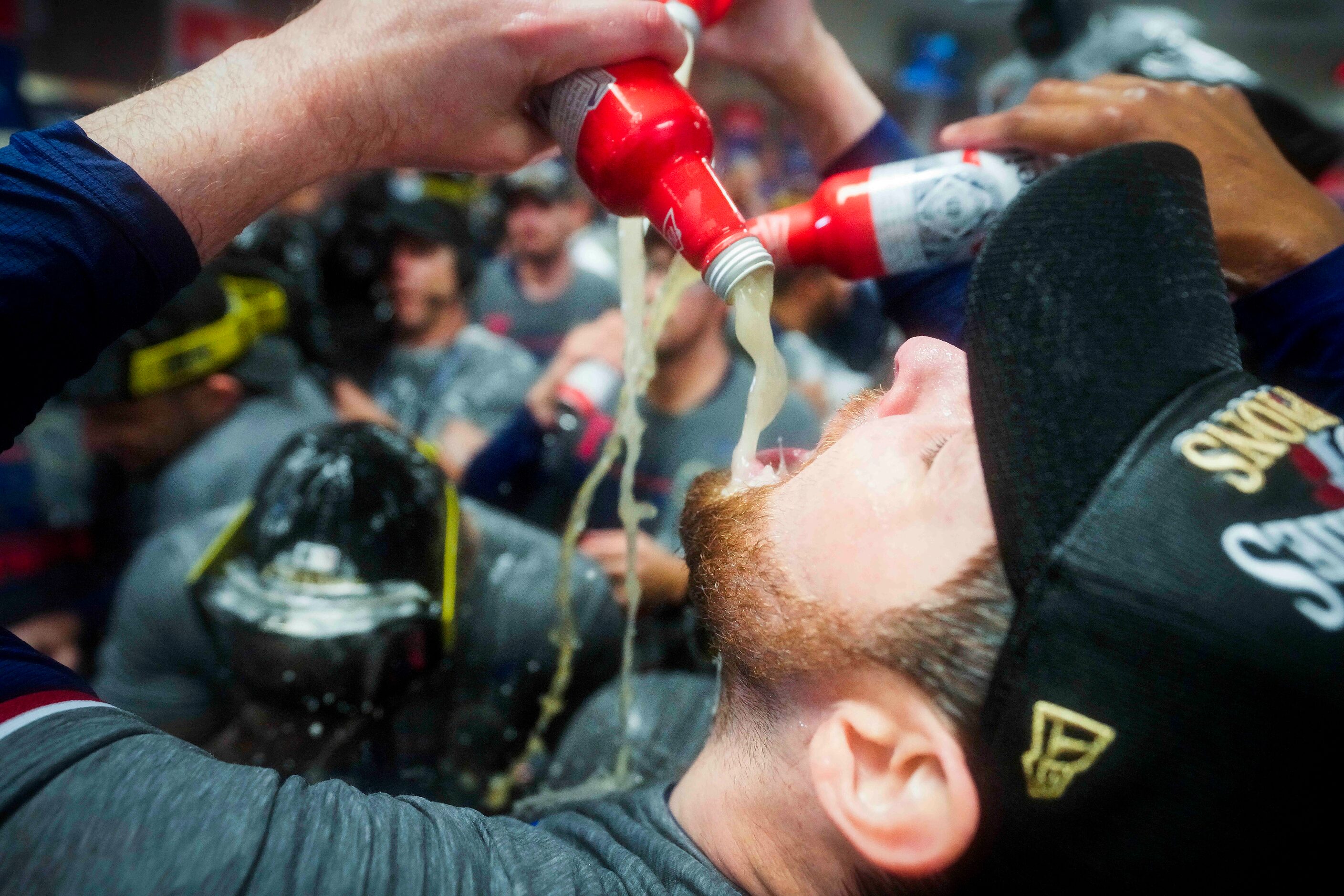 Texas Rangers starting pitcher Jordan Montgomery celebrates in the clubhouse after defeating...