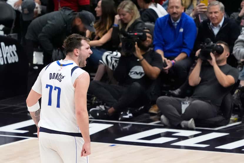 Dallas Mavericks guard Luka Doncic celebrates after scoring during the second half in Game 2...