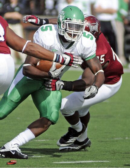 North Texas running back Lance Dunbar (5) runs with the ball during the first half of the...