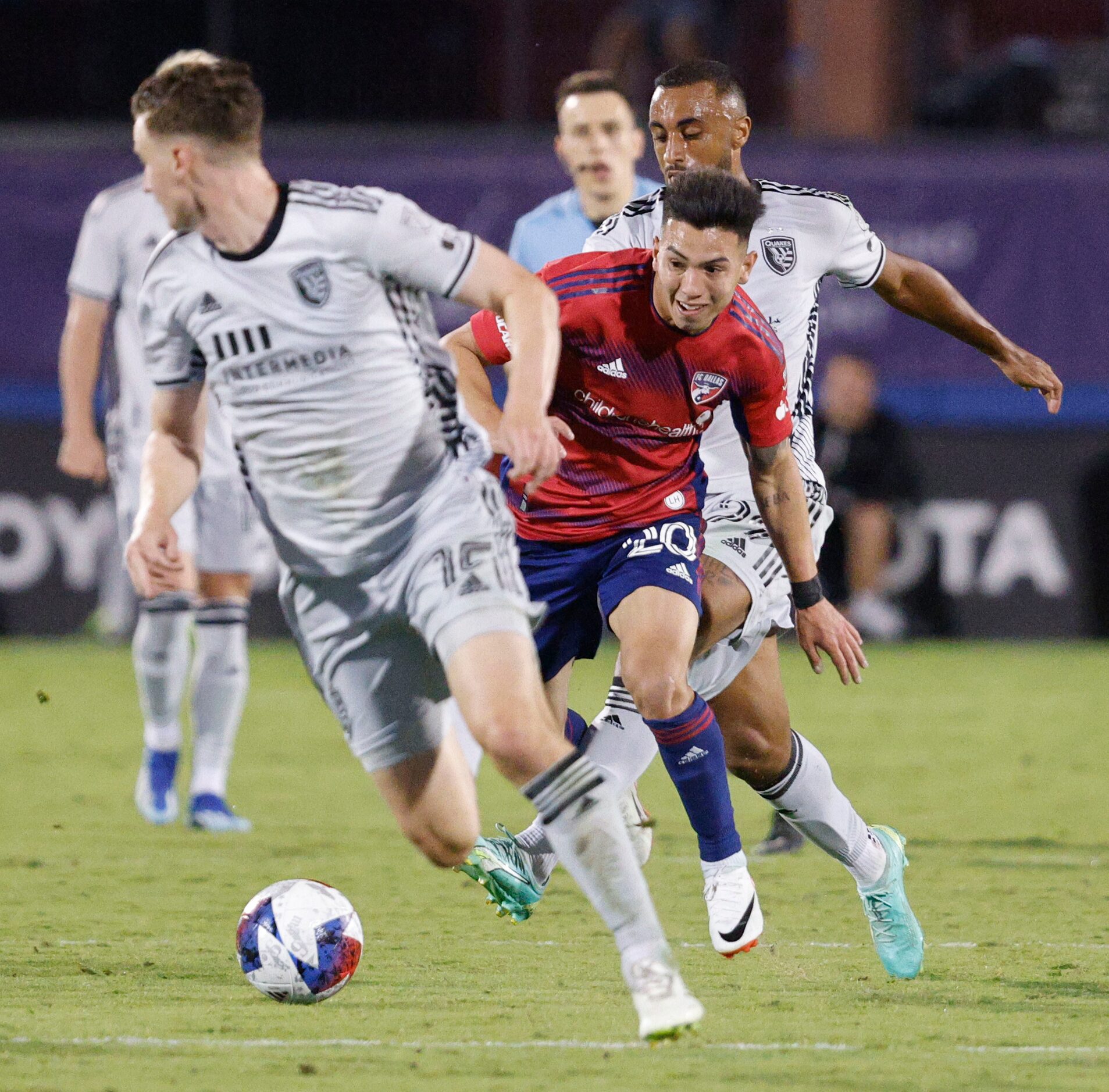 FC Dallas forward Alan Velasco (20) tries to get the ball from San Jose Earthquakes defender...