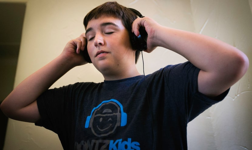 Alex Aughenbaugh listens to music while DJing at his house in Southlake.