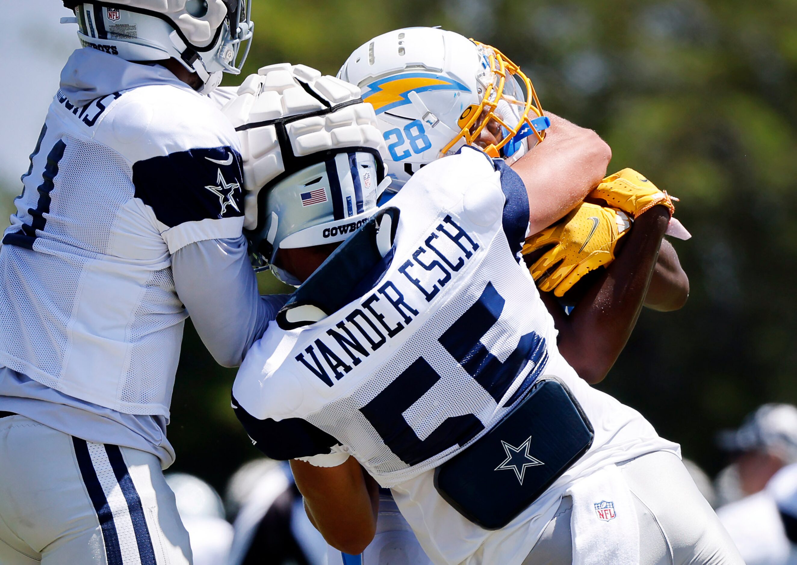 Dallas Cowboys linebackers Leighton Vander Esch (55) and Micah Parsons (11) stop Los Angeles...