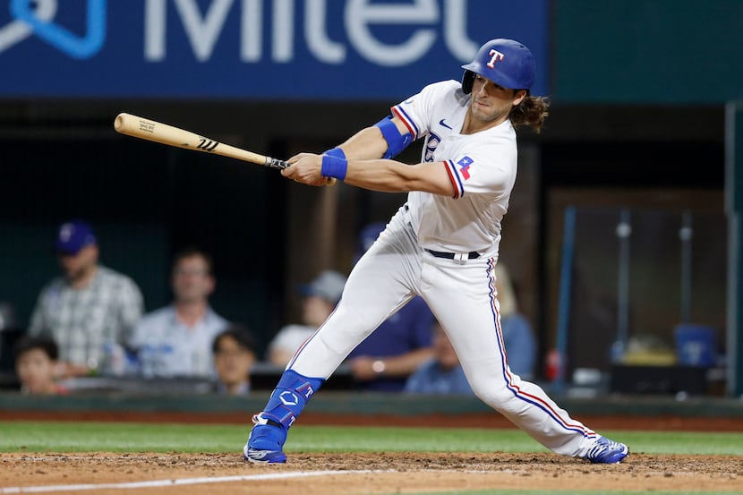 Texas Rangers third baseman Josh Smith (47) swings at a pitch during the ninth inning of a...