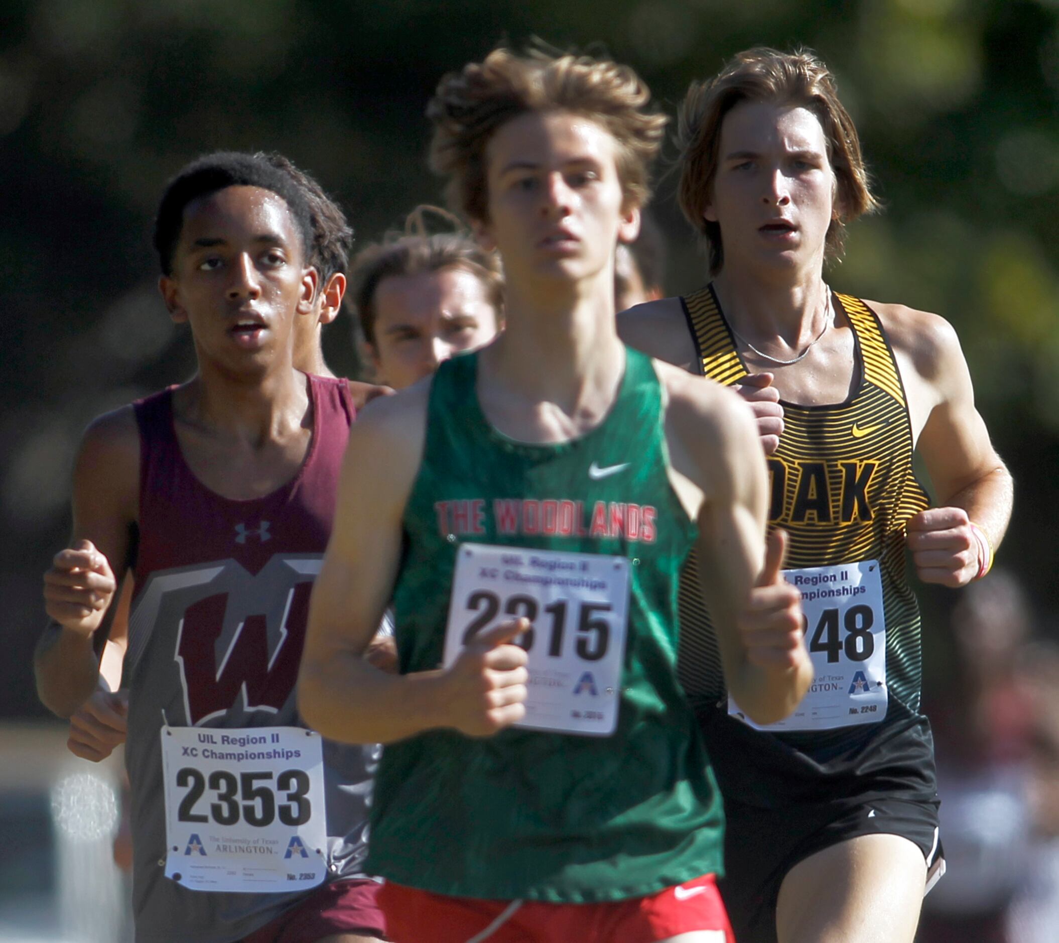 Wylie's Nathanael Berhane, (bib number 2353), left, finished in 2nd place with a time of...