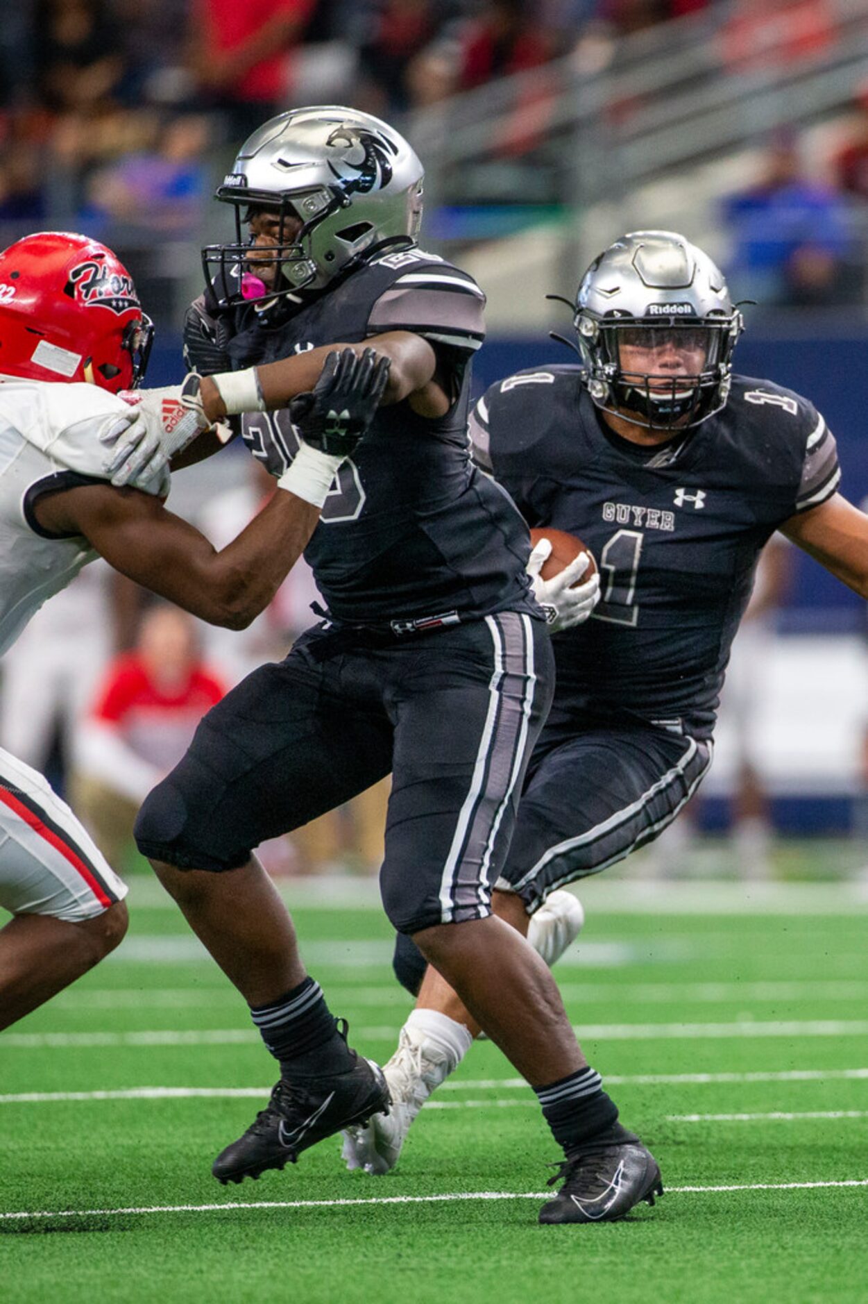 Denton Guyer running back Kaedric Cobbs (1) makes a run for yards during the final quarter...