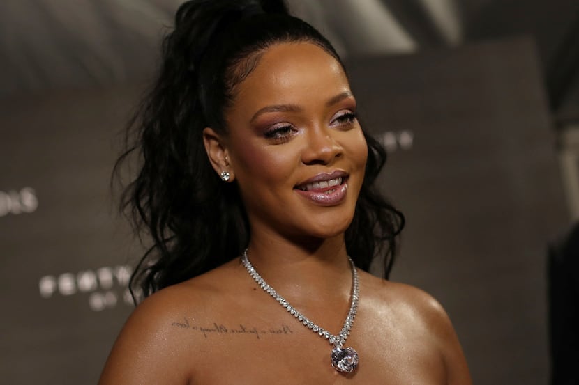 Rihanna shines for photographers upon arrival at the Fenty Beauty by Rihanna fashion range...