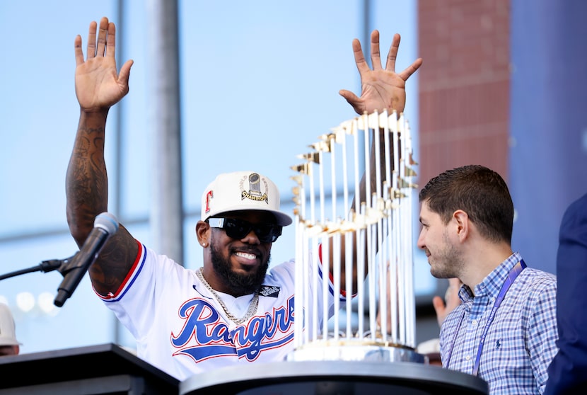 Texas Rangers right fielder Adolis Garcia waves to fans as he speaks during the World Series...