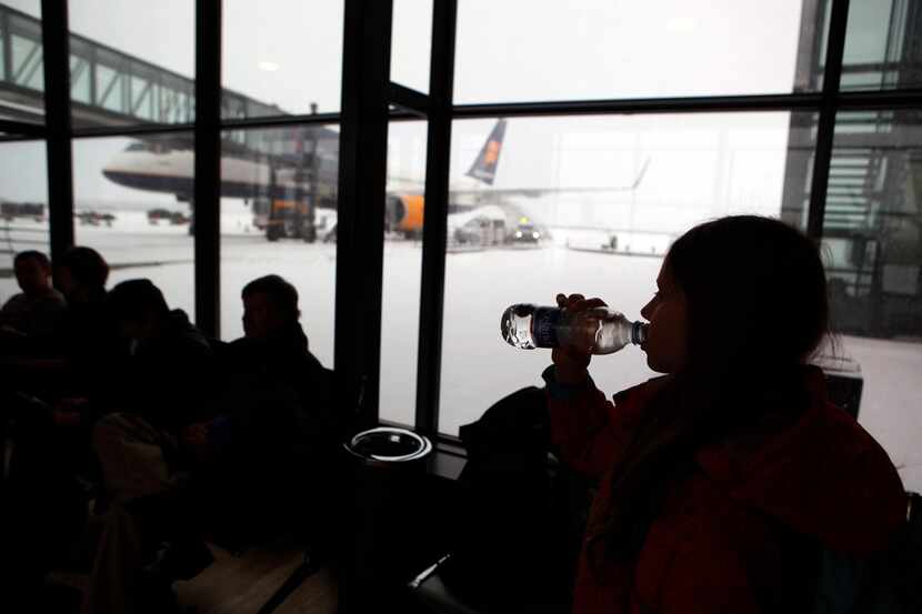 Passengers wait for flights with flagship carrier Icelandair at Iceland's Trans-Atlantic...