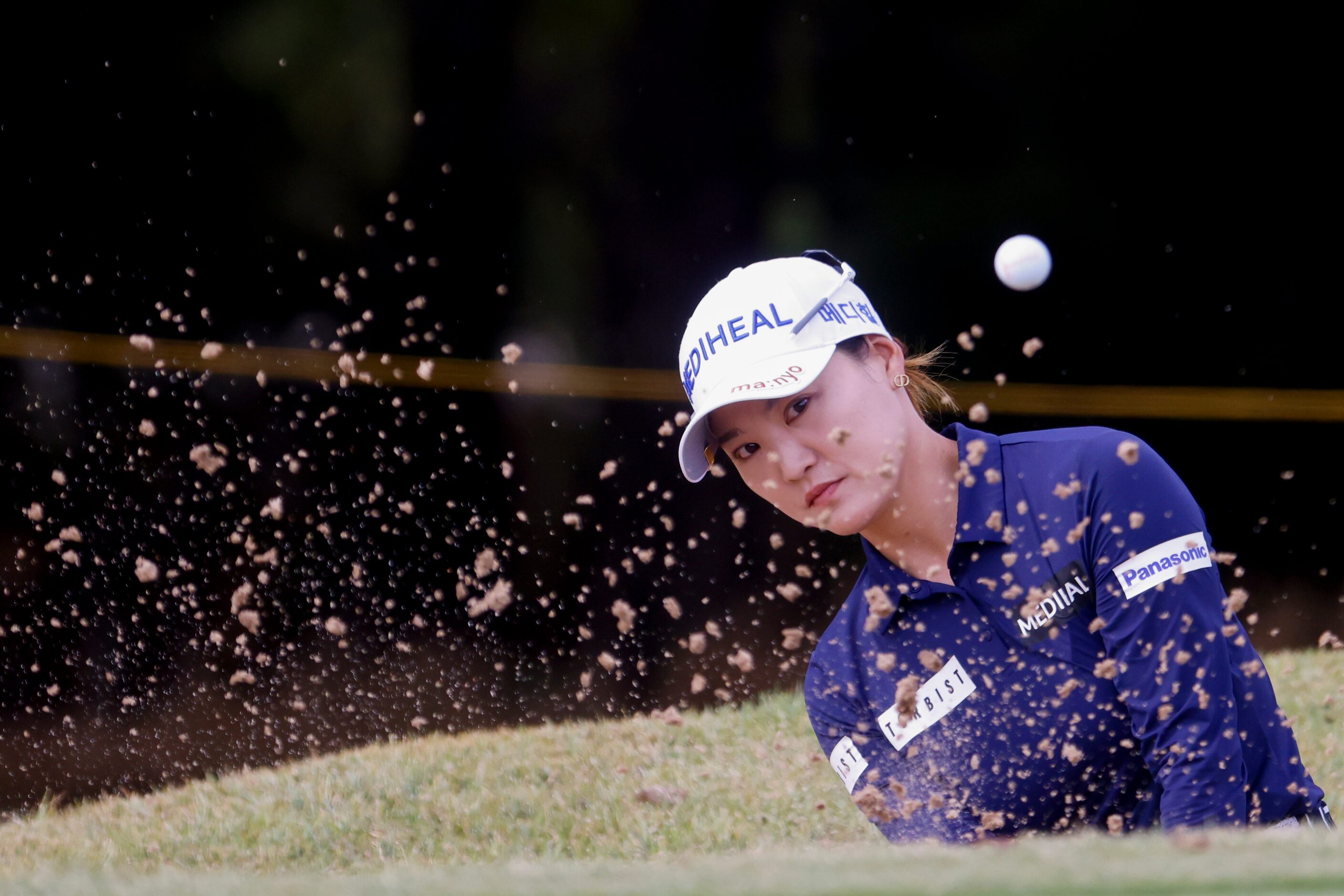 So Yeon Ryu of South Korea hits out of a sand trap on the 11th fairway during the first...