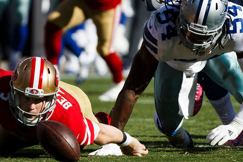 San Francisco 49ers quarterback C.J. Beathard (3) watches his own fumble bounce away after...