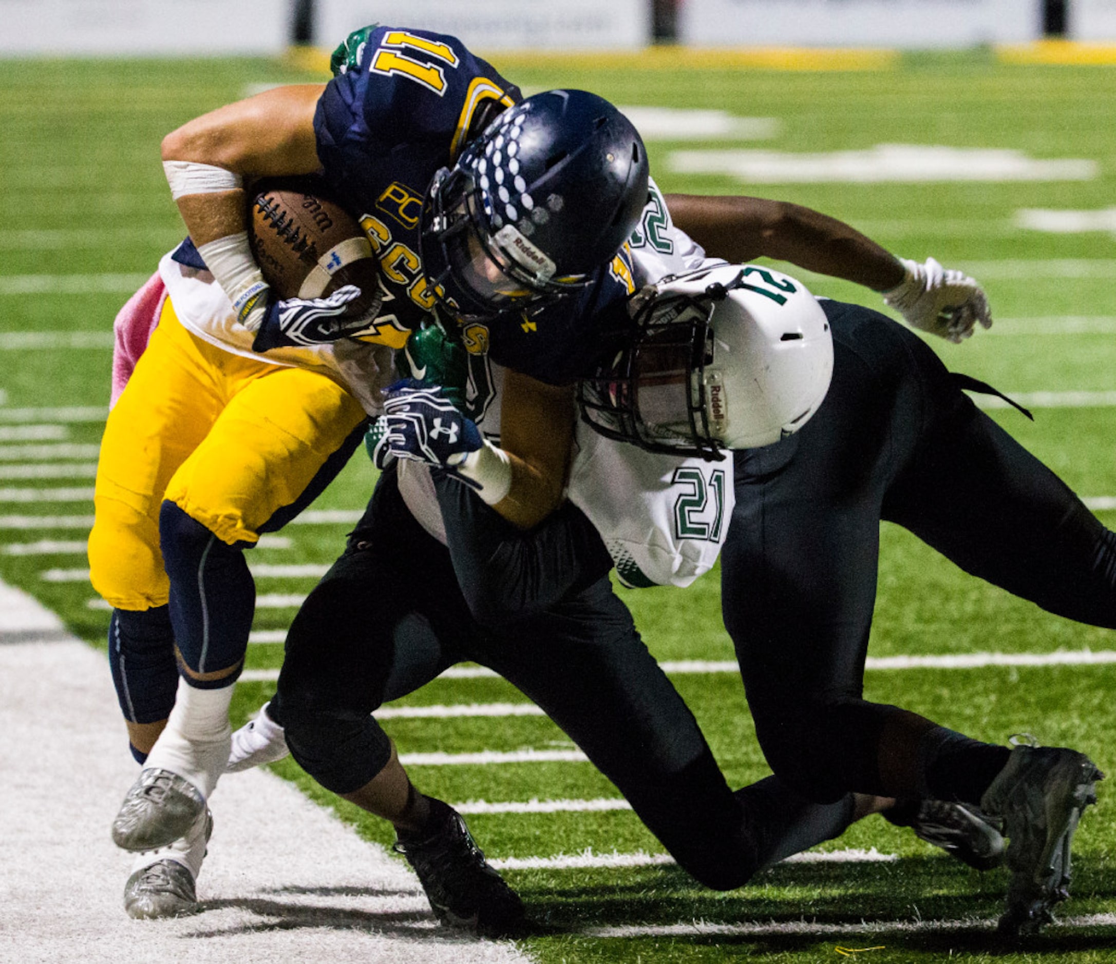 Highland Park wide receiver Jack Toohey (11) is pushed out of bounds by Mesquite Poteet...