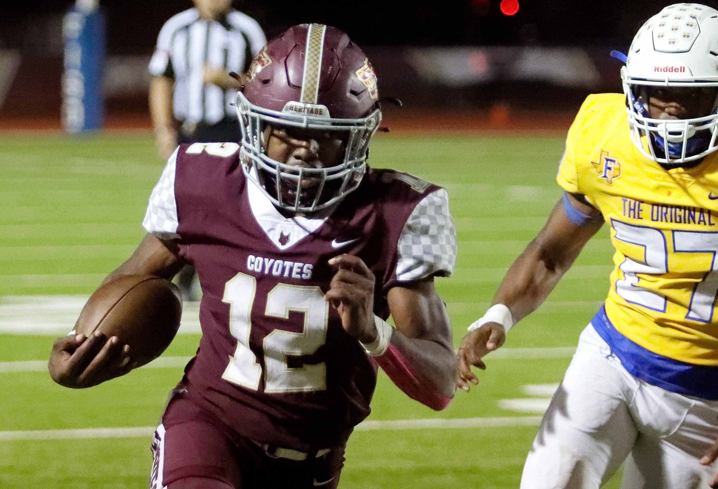 Frisco Heritage High School running back Kentra Britton (12) is chased by Frisco High School...