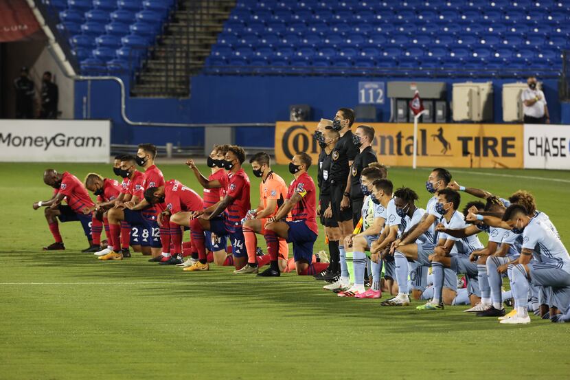 FRISCO, TX - OCTOBER 3: Players of FC Dallas and Sporting Kansas City teams  kneel during...