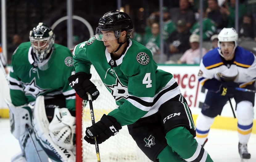 DALLAS, TX - SEPTEMBER 18:  Miro Heiskanen #4 of the Dallas Stars skates the puck against...