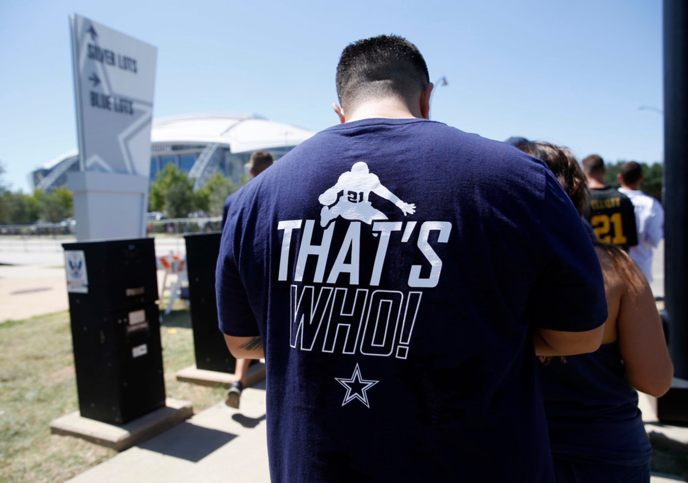 Dallas Cowboys fan makes his way to the stadium sporting a Dallas Cowboys running back...