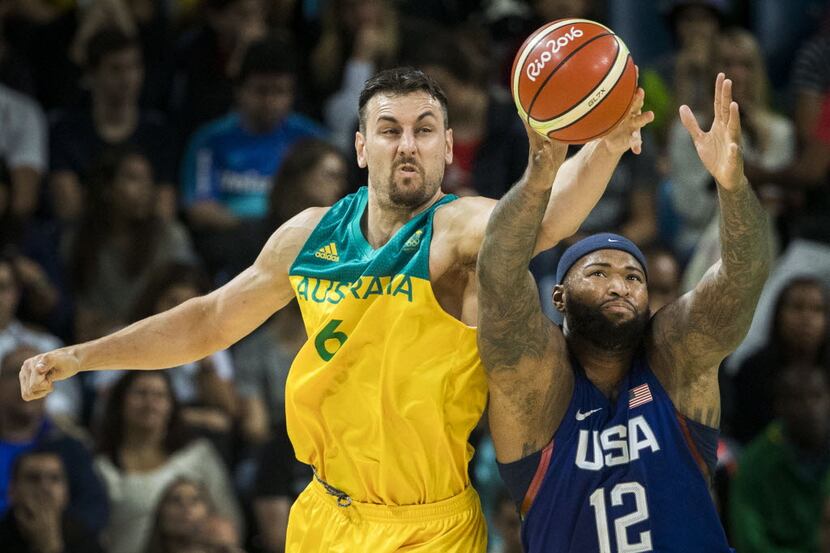 Andrew Bogut (6) of Australia knocks the ball away from Demarcus Cousins (12) of the United...