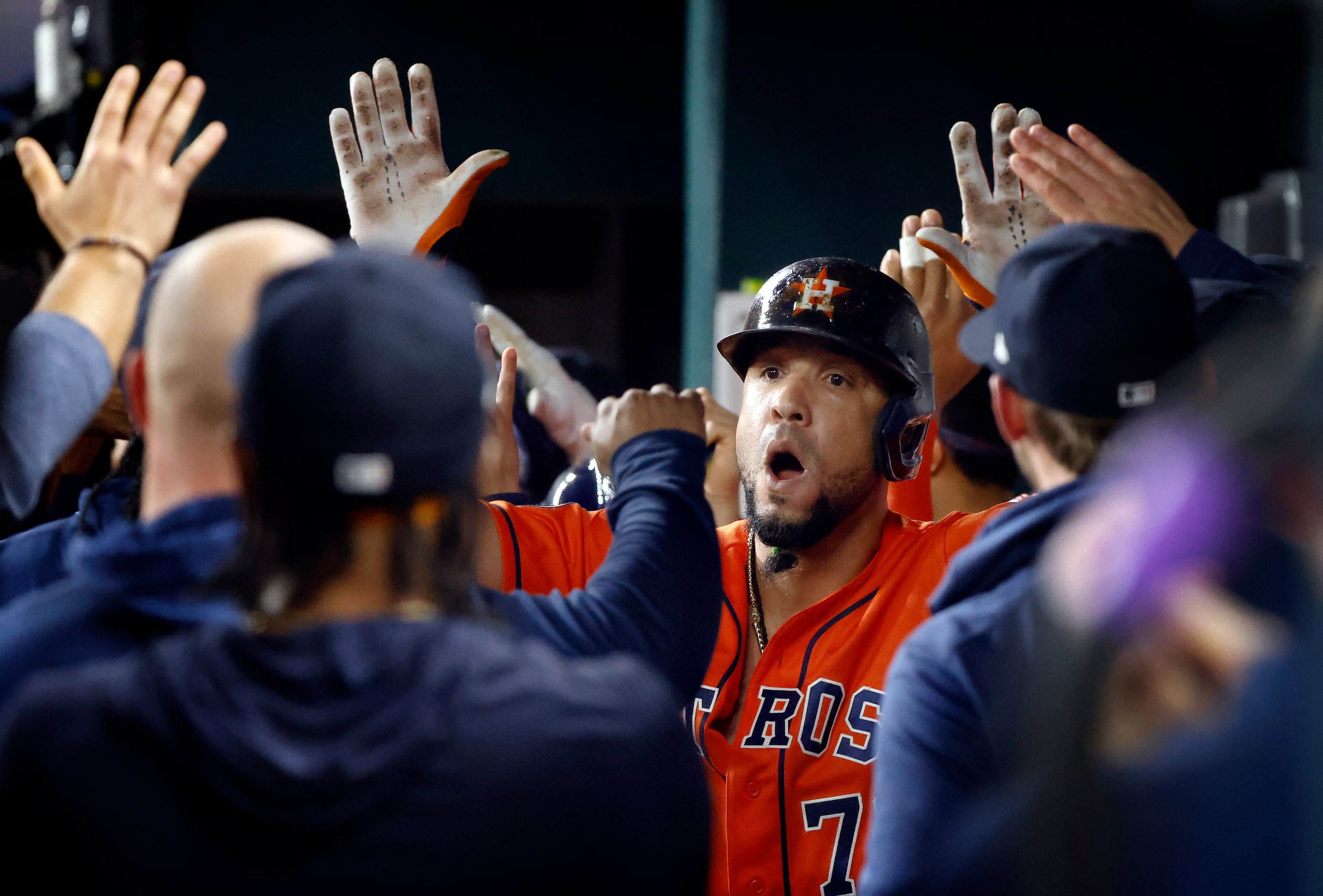 Houston Astros Jose Abreu is congratulated by teammates in the dugout after hitting a...