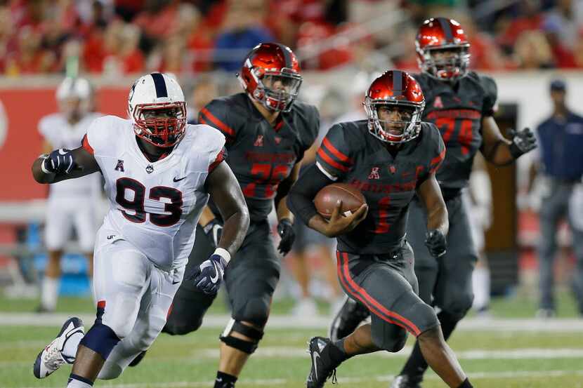 HOUSTON, TX - SEPTEMBER 29: Greg Ward Jr. #1 of the Houston Cougars rushes with the ball as...