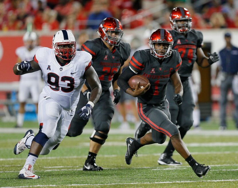 HOUSTON, TX - SEPTEMBER 29: Greg Ward Jr. #1 of the Houston Cougars rushes with the ball as...