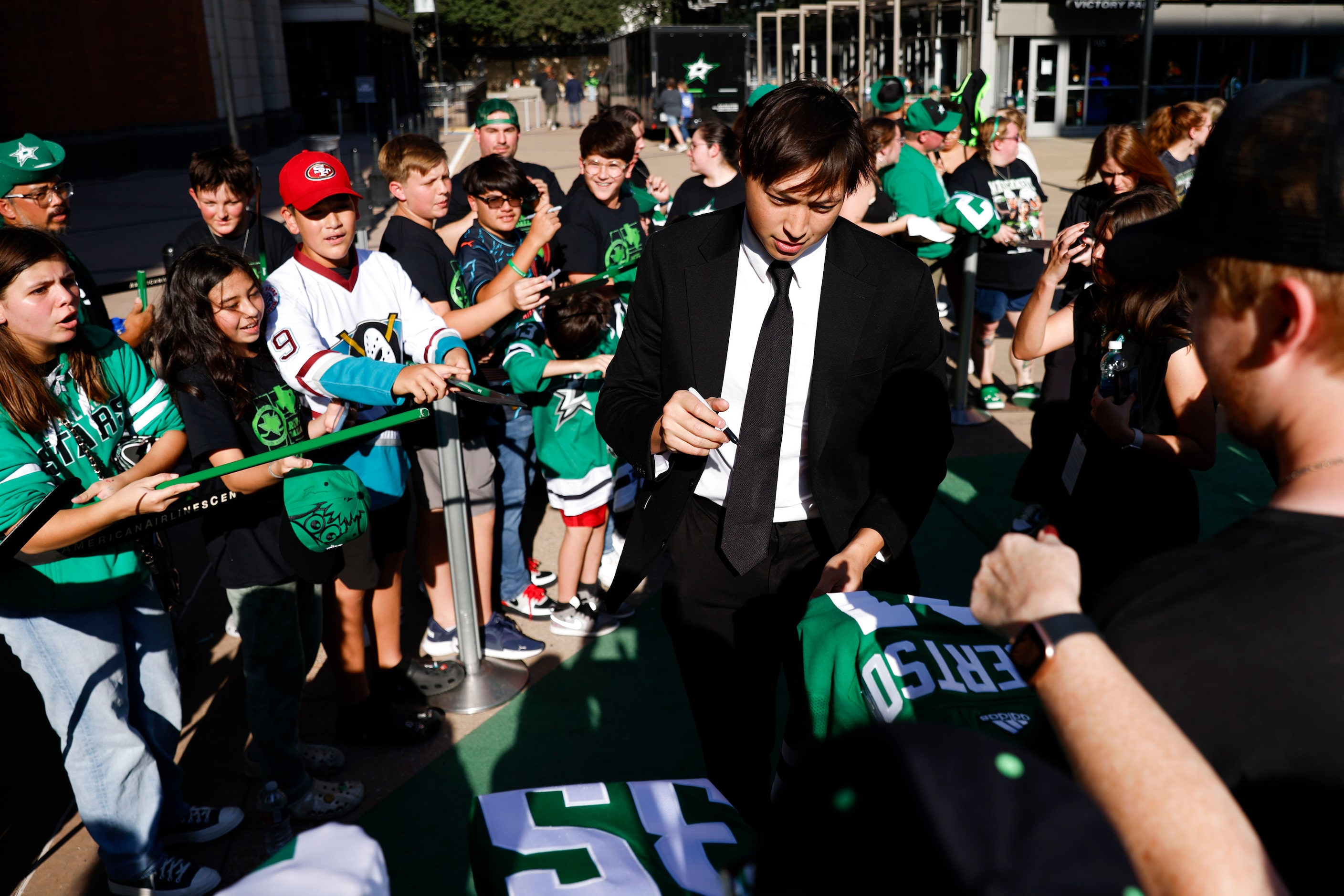 Dallas Stars left wing Jason Robertson interacts with the crowd during the team’s home...