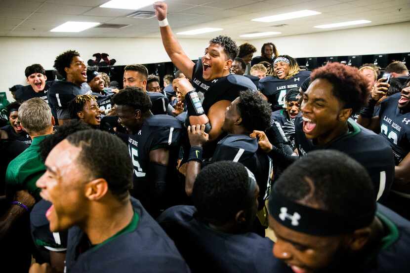 Mansfield Lake Ridge celebrates a 34-29 win over Desoto after their District 7 6A high...