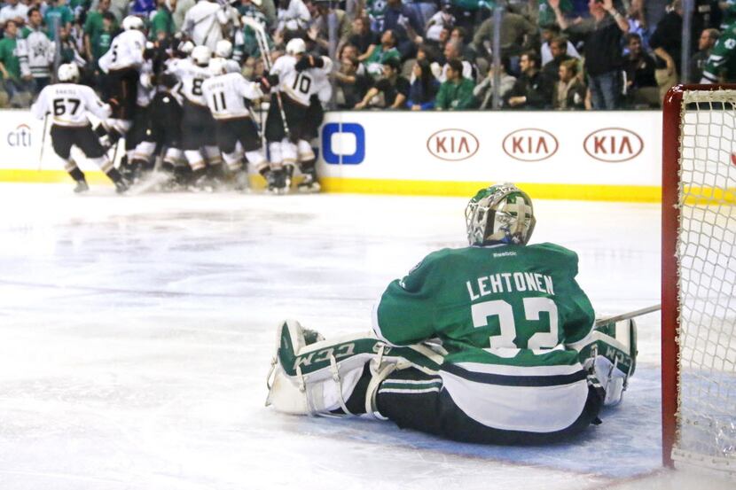Dallas Stars goalie Kari Lehtonen (32) sits disconsolately on the ice as the Anaheim Ducks...