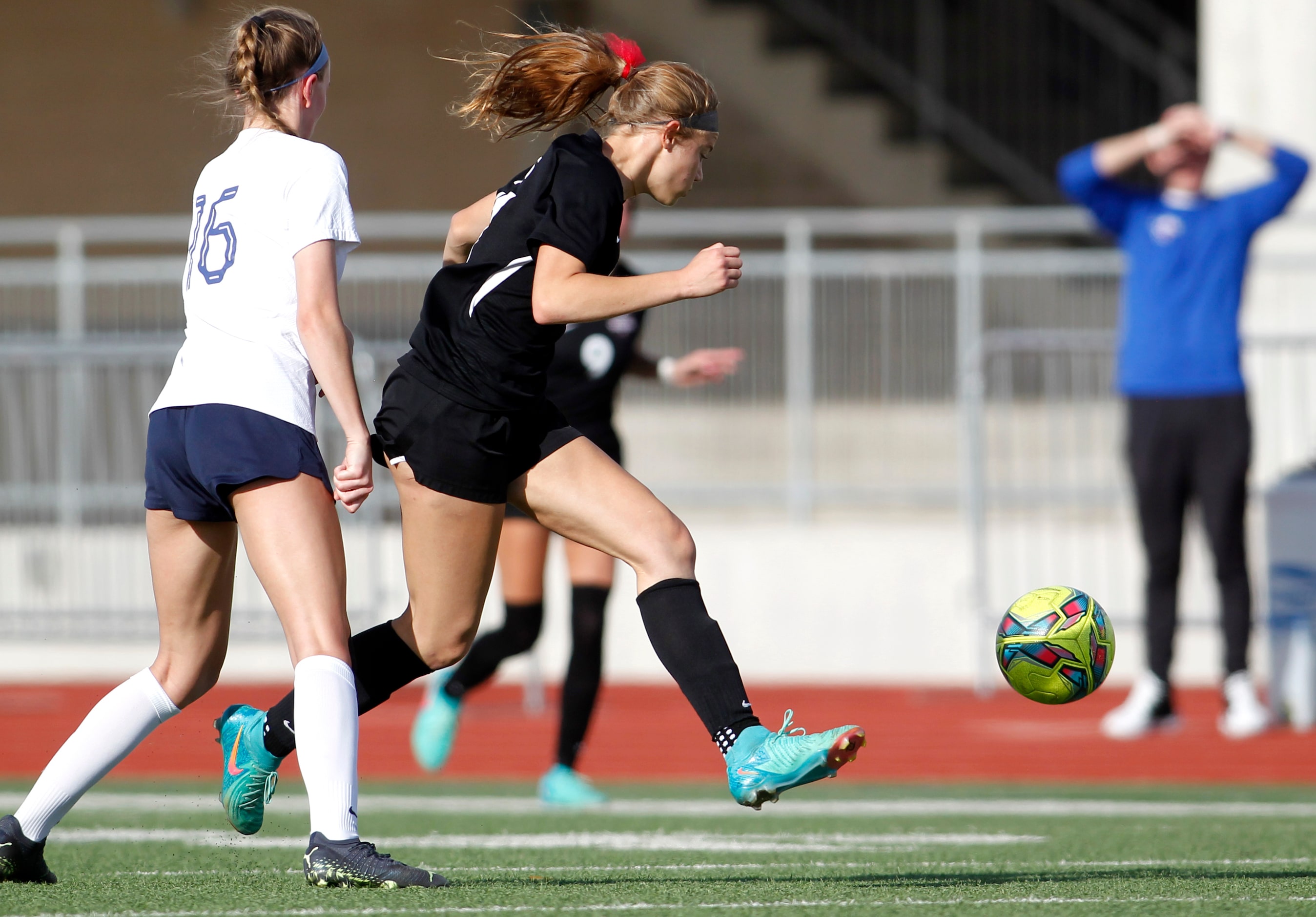 Flower Mound Marcus forward Madi Patterson (17), center, sprints during an offensive drive...