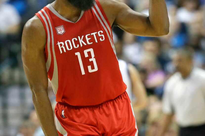 Houston Rockets guard James Harden (13) reacts to hitting a three pointer during the second...