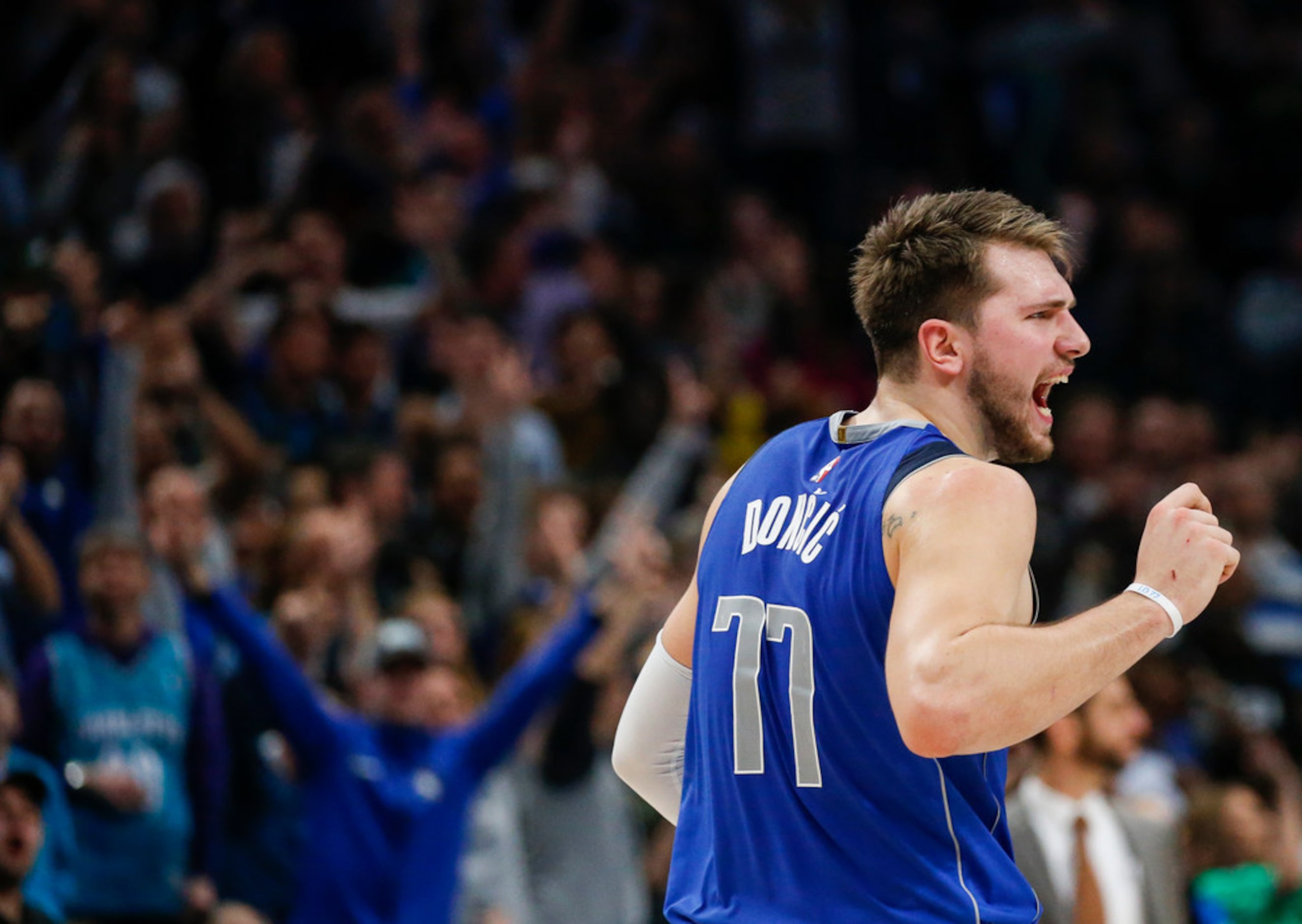 Dallas Mavericks forward Luka Doncic (77) celebrates a play during overtime in a NBA...