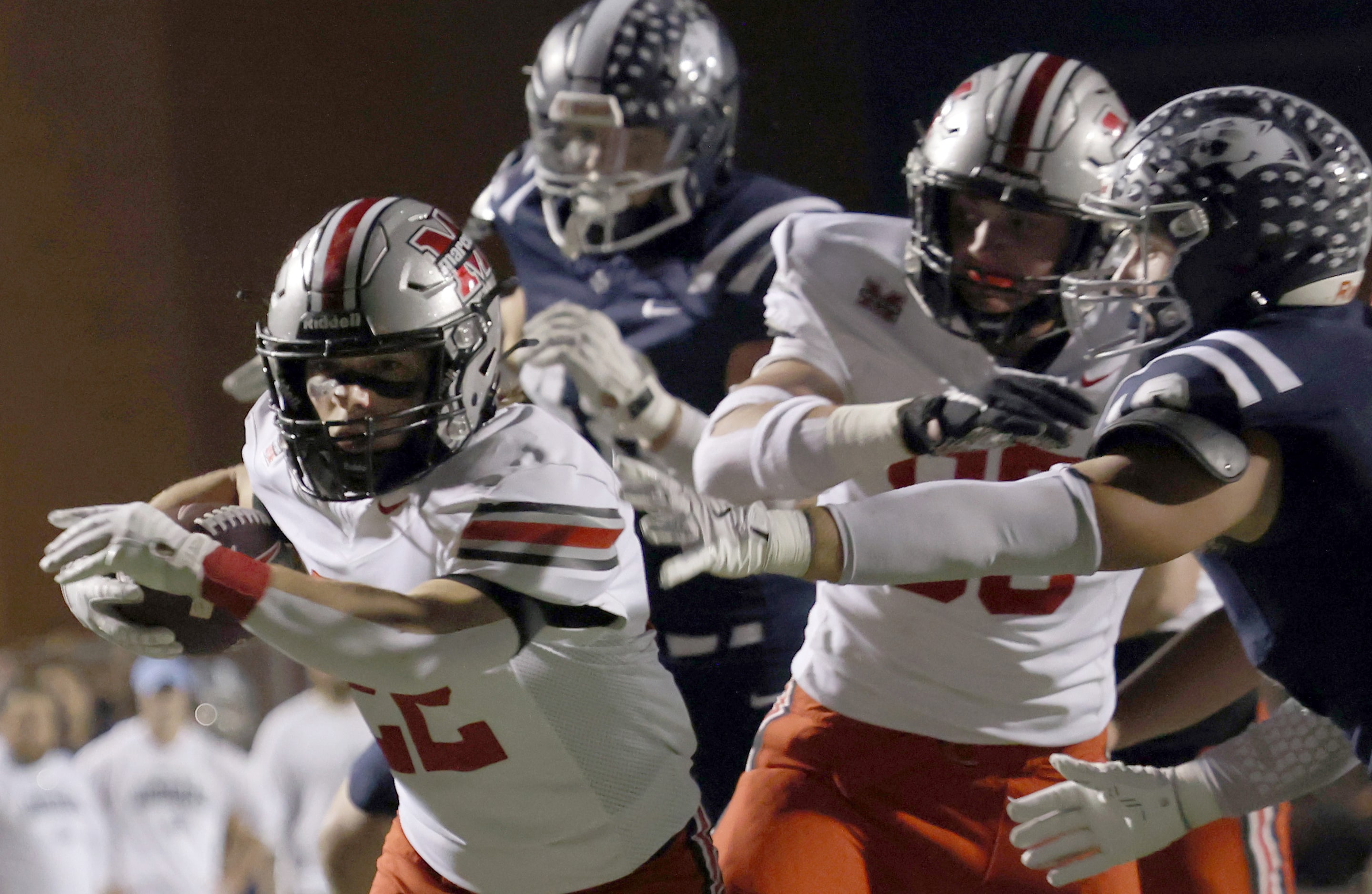 Flower Mound Marcus running back Mason Jones, (22), left, powers into the end zone for a...