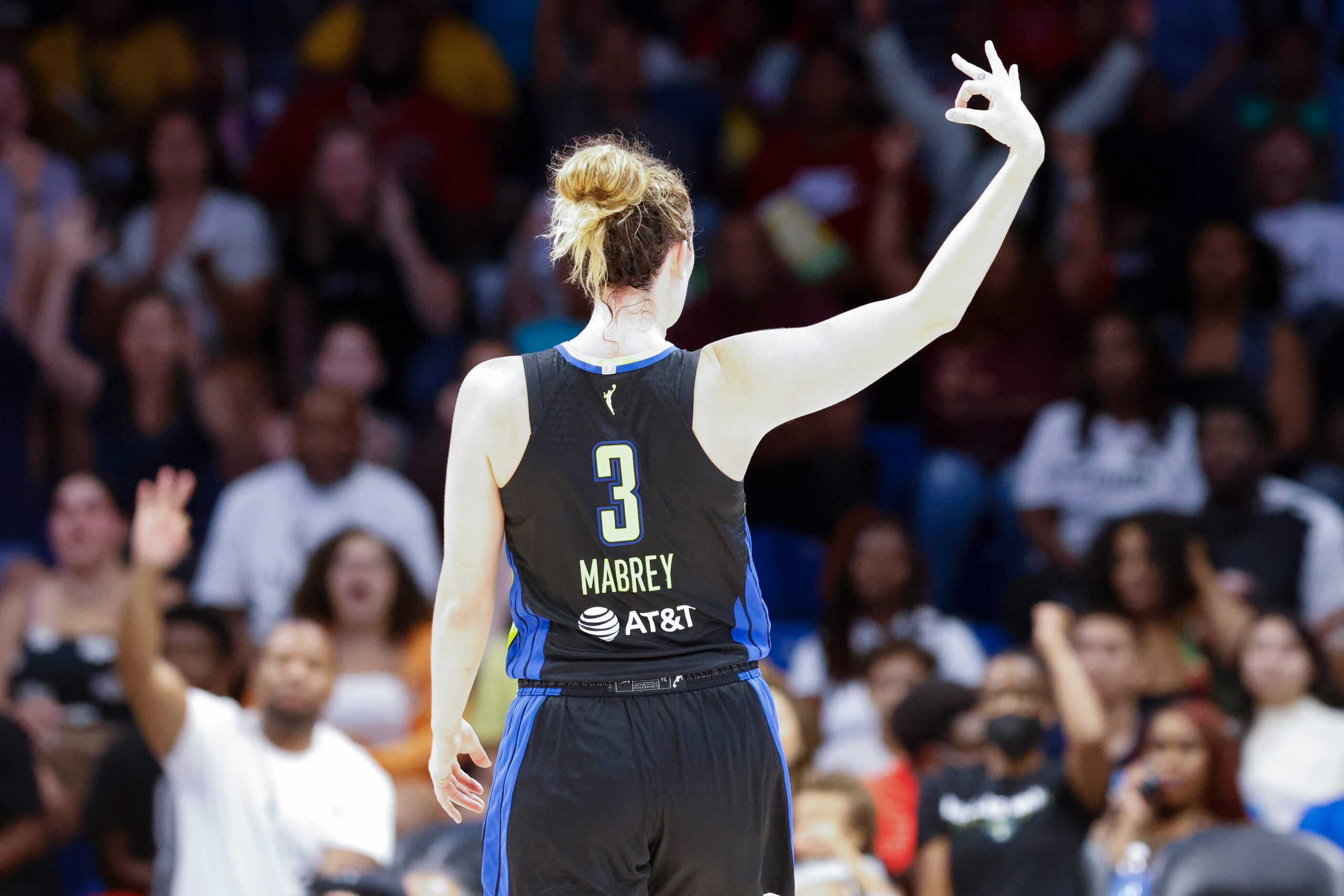 Dallas Wings guard Marina Mabrey (3) reacts after scoring a three-pointer against Chicago...