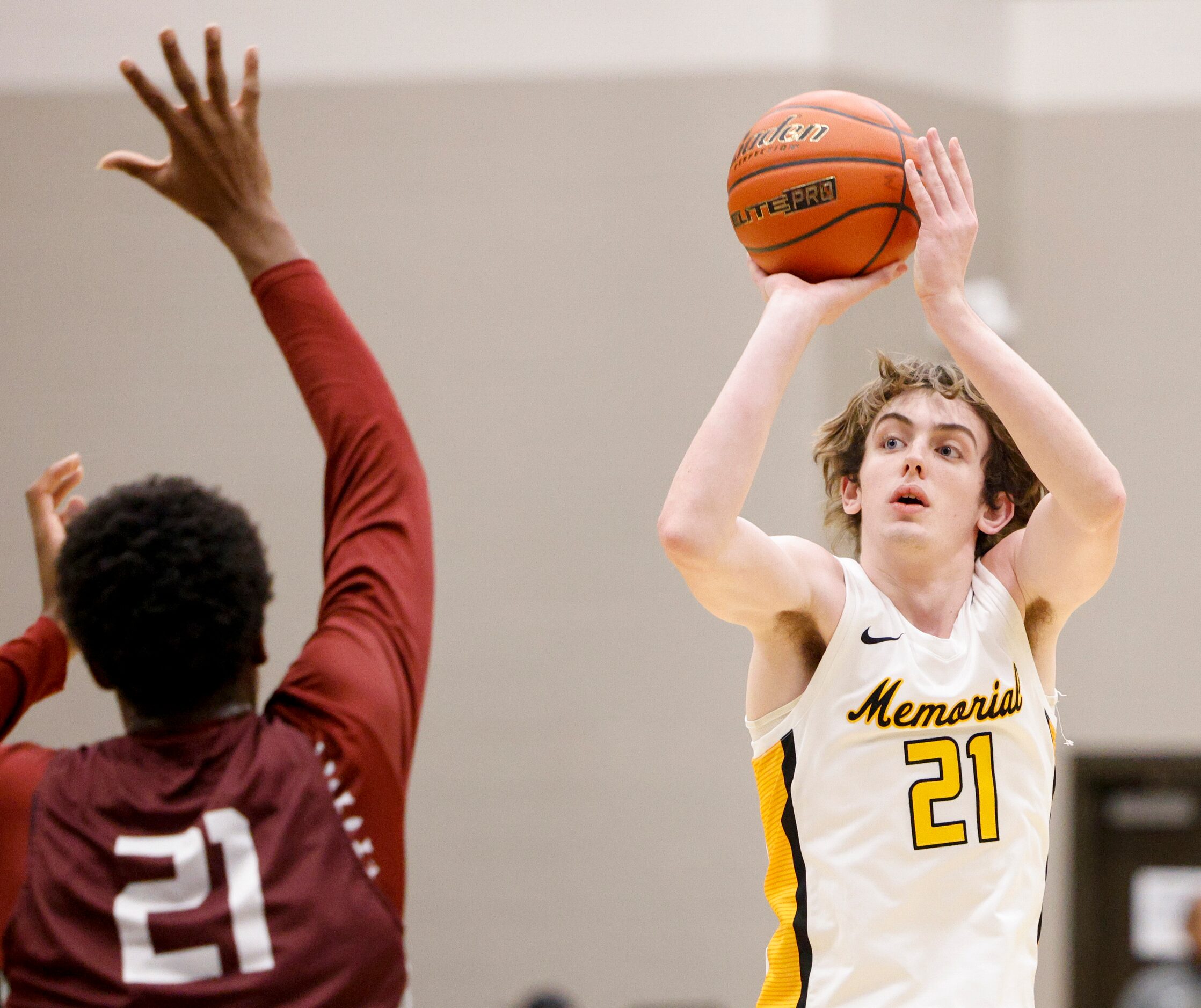 Frisco Memorial guard Drew Steffe (21) attempts a three-point shot over Plano forward Justin...