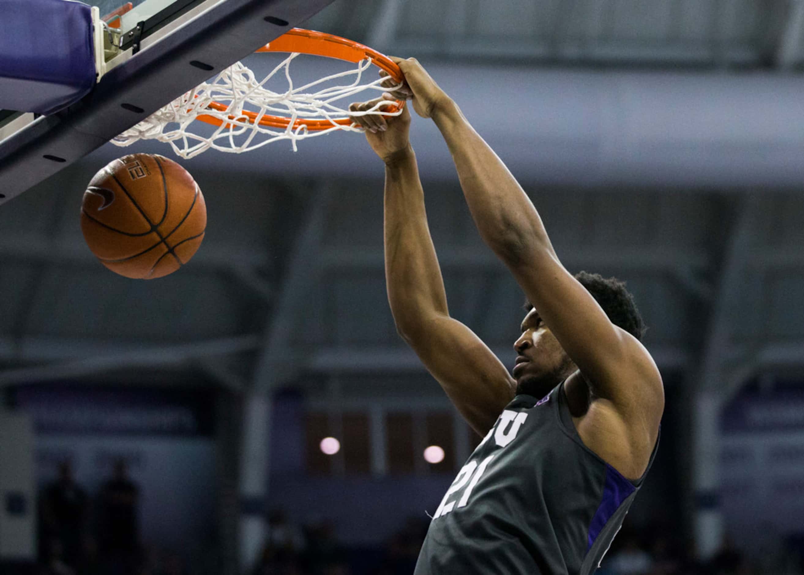 TCU Horned Frogs center Kevin Samuel (21) dunks the ball during the second half of an NCAA...