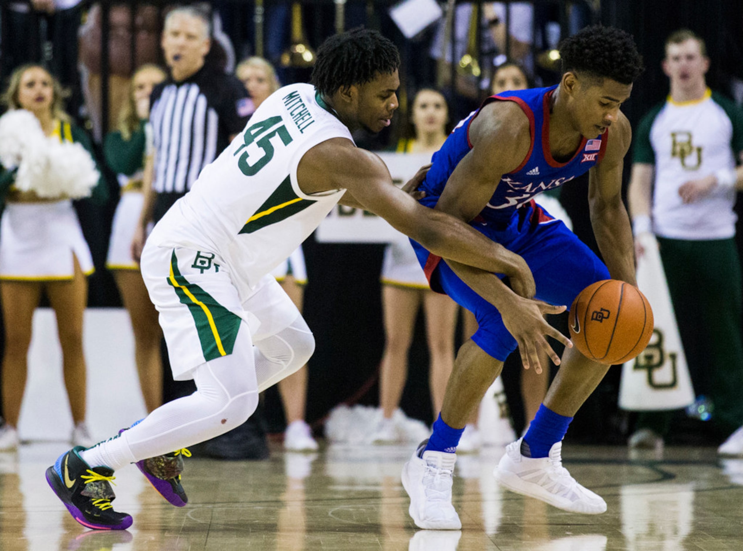 Baylor Bears guard Davion Mitchell (45) fouls Kansas Jayhawks guard Ochai Agbaji (30) during...