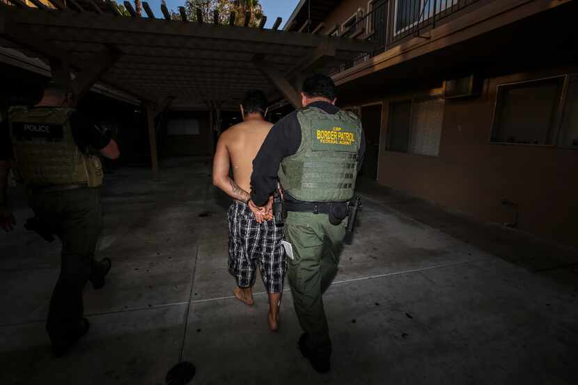 An ICE Enforcement and Removal Operations unit raid to apprehend immigrants without any...