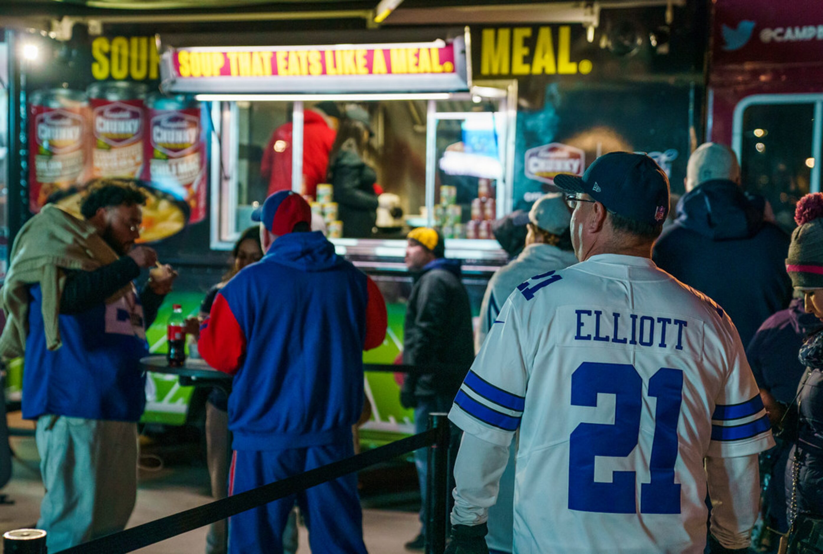 Dallas Cowboys line up at food truck while tailgating before a Monday Night Football game...