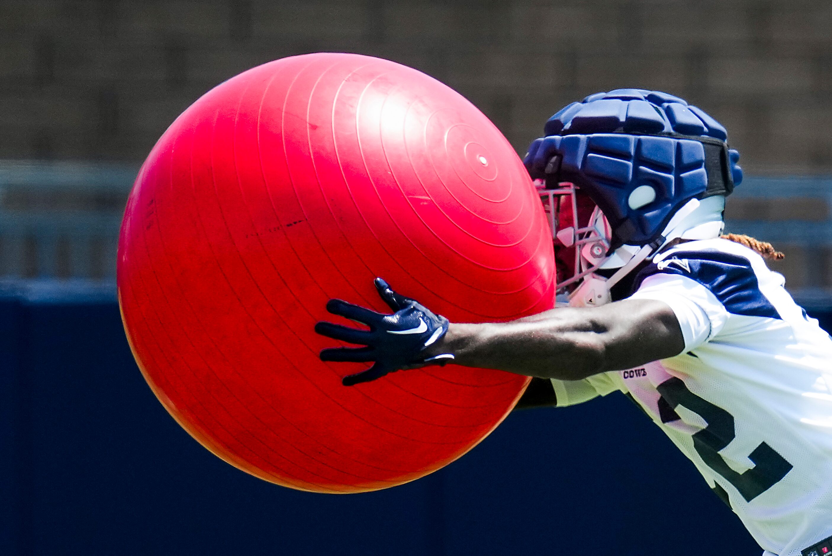 Dallas Cowboys running back Deuce Vaughn participates in a drill during a training camp...