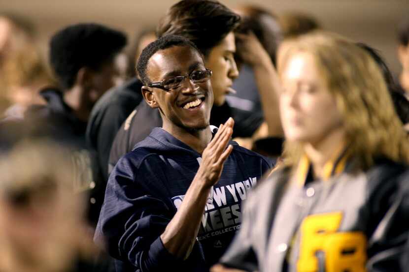 Fossil Ridge football manager K.L. Norwood, works the side lines in game action at Birdville...