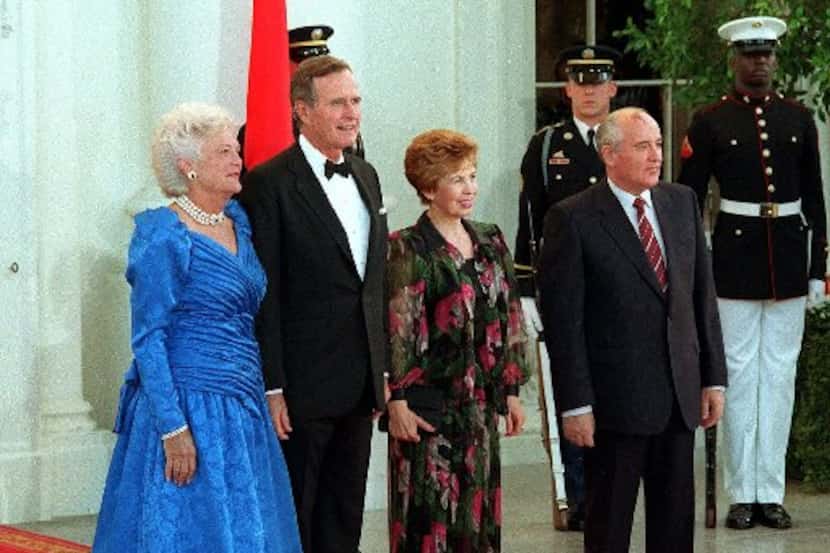 President George Bush and first lady Barbara Bush welcomed Soviet President Mikhail...
