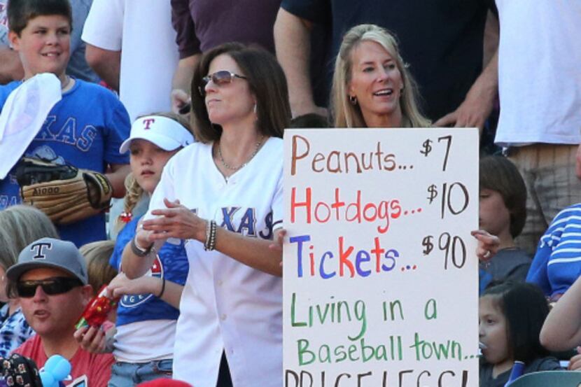 A fan at the Rangers' game Sunday held a sign responding to current Angel and former Ranger...